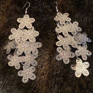Silver hanging earring with flower detail
